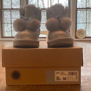 Ugg Little Girls 10 Toddler boots in silver metallic with pom poms.